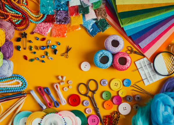 Colourful craft materials like beads, threads, scissors, and felt used in Iyali’s Terracotta and Jewellery Making Workshops in Chennai.