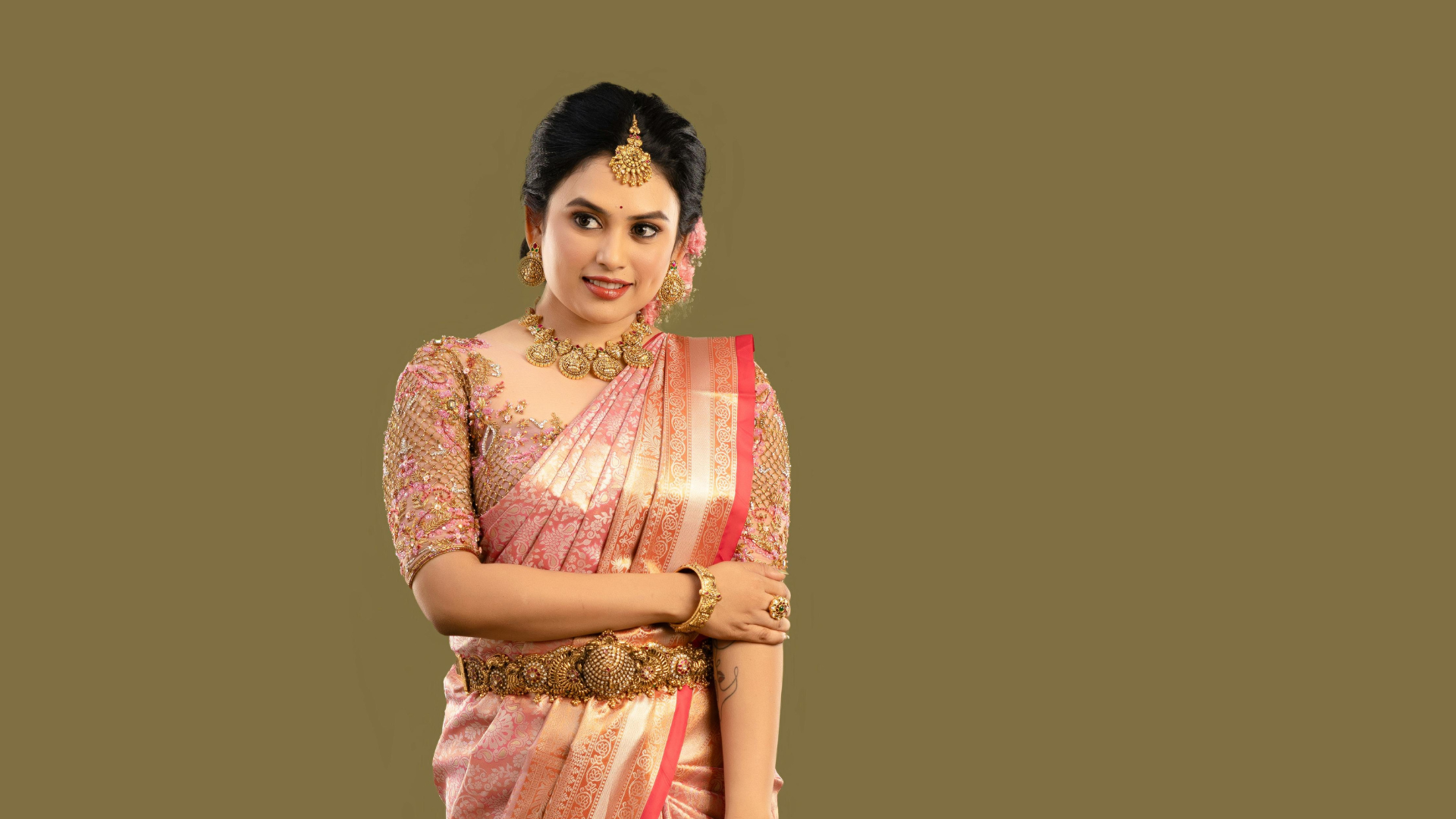 Woman dressed in a traditional saree posing gracefully, representing Iyali’s beauty and saree-styling workshops in Chennai.