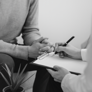 Expert guiding a participant through personality assessment results in a one-on-one interpretation session.
