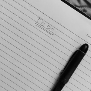 Open notebook with a pen placed on a blank page symbolizing a personalized growth plan.