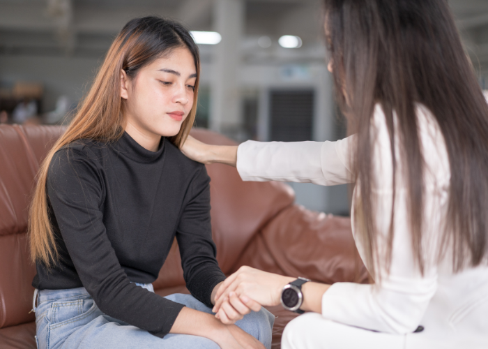 Counsellor offering emotional support to a young woman during a mental well-being session at Iyali Chennai.
